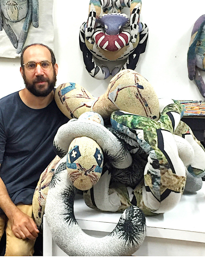 artist David Smith in his studio with one of his textile sculptures; photo erica lewis